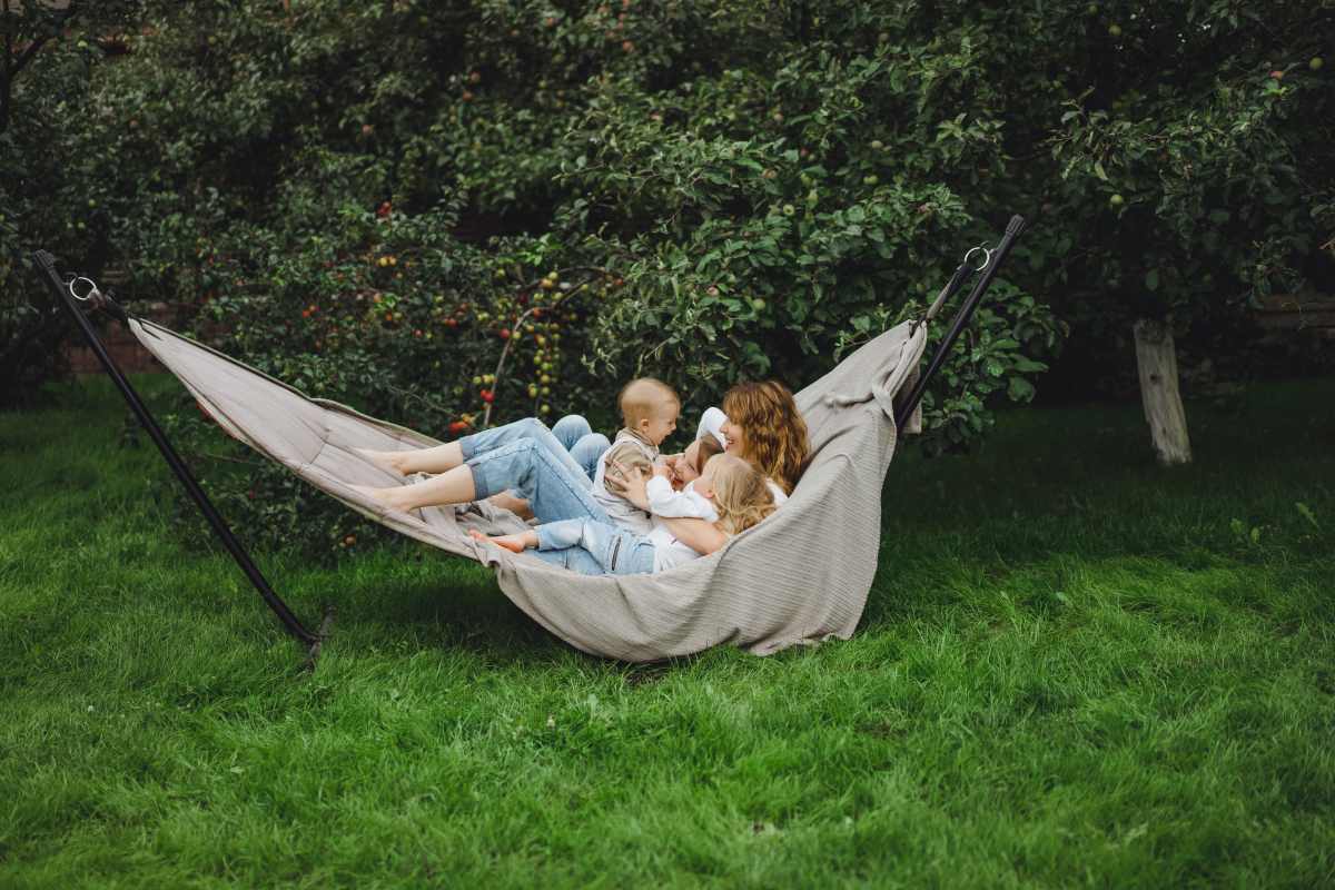 mother-with-children-having-fun-in-a-hammock-mom-and-kids-in-a-hammock