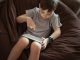 little-kid-boy-using-tablet-sitting-on-the-bean-ba--utc-