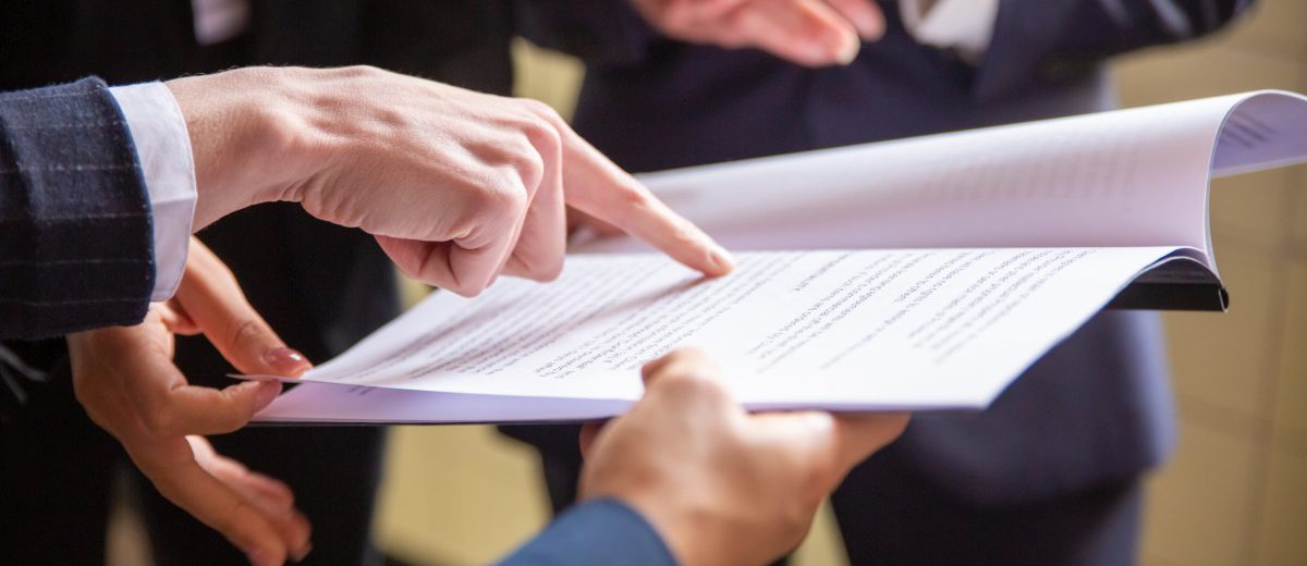 cropped-view-businesswomen-reading-document-1200x520.jpg