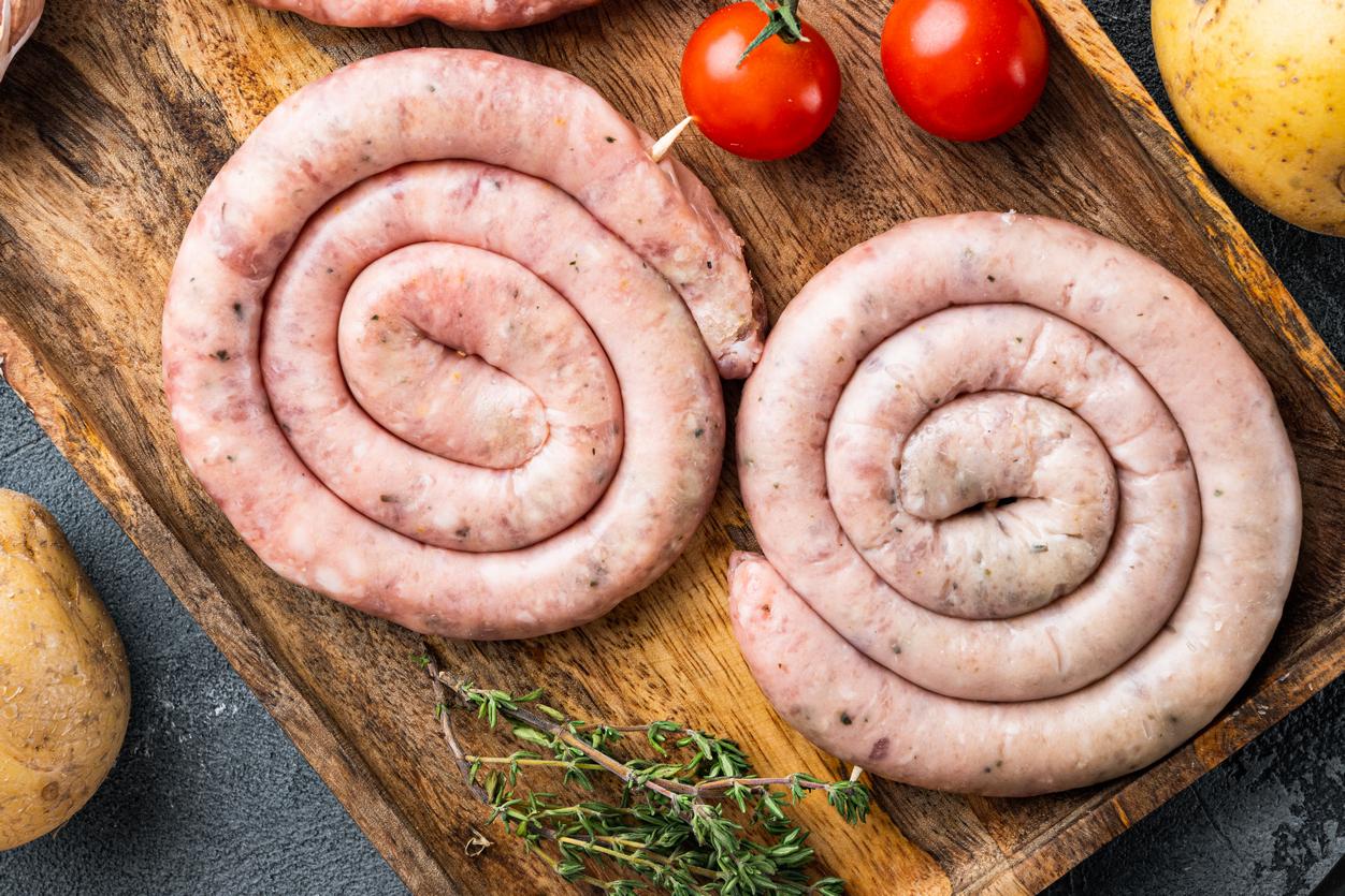 Raw meat sausage, on gray background, top view flat lay