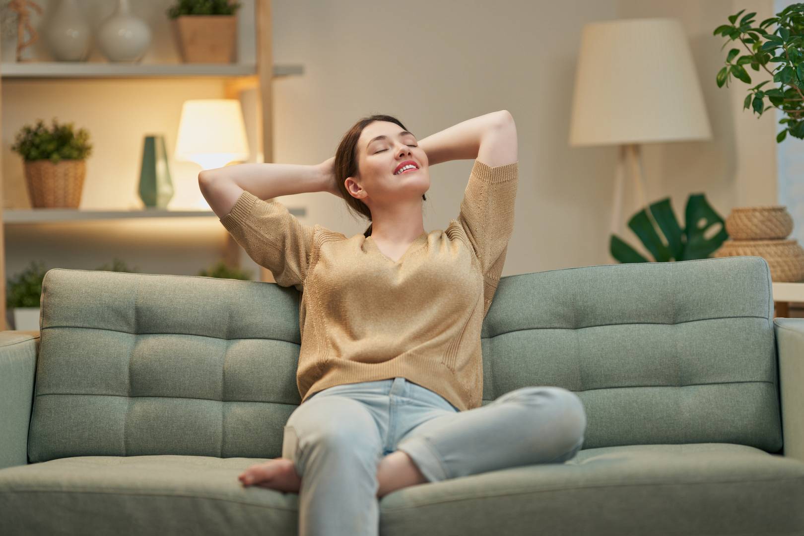 woman resting on sofa