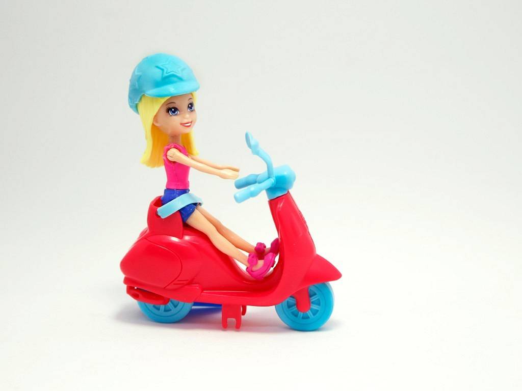 Polly Pocket on motorcycle scooter. Polly Pocket. Doll. Toy. Do