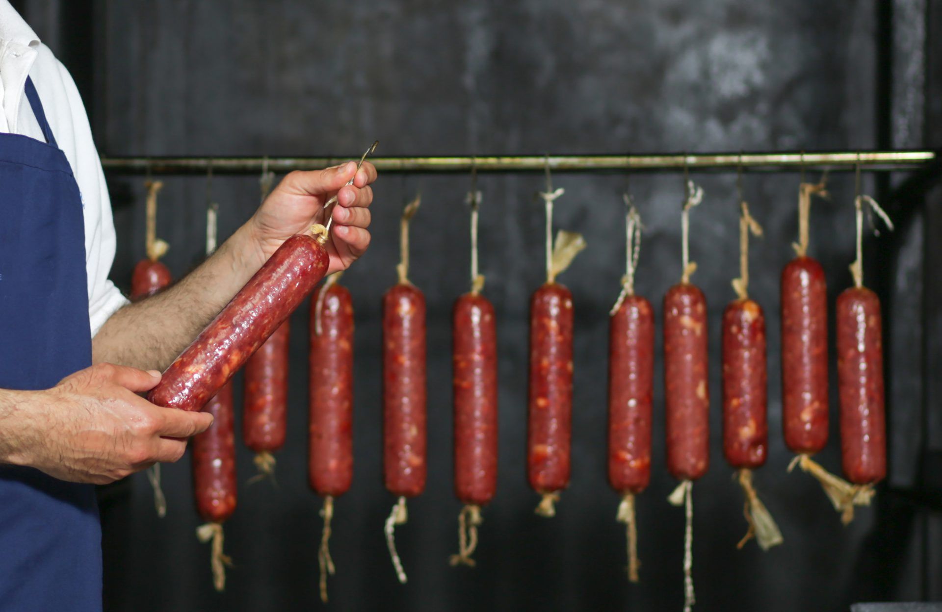 massive sausage producted hanged inside factory