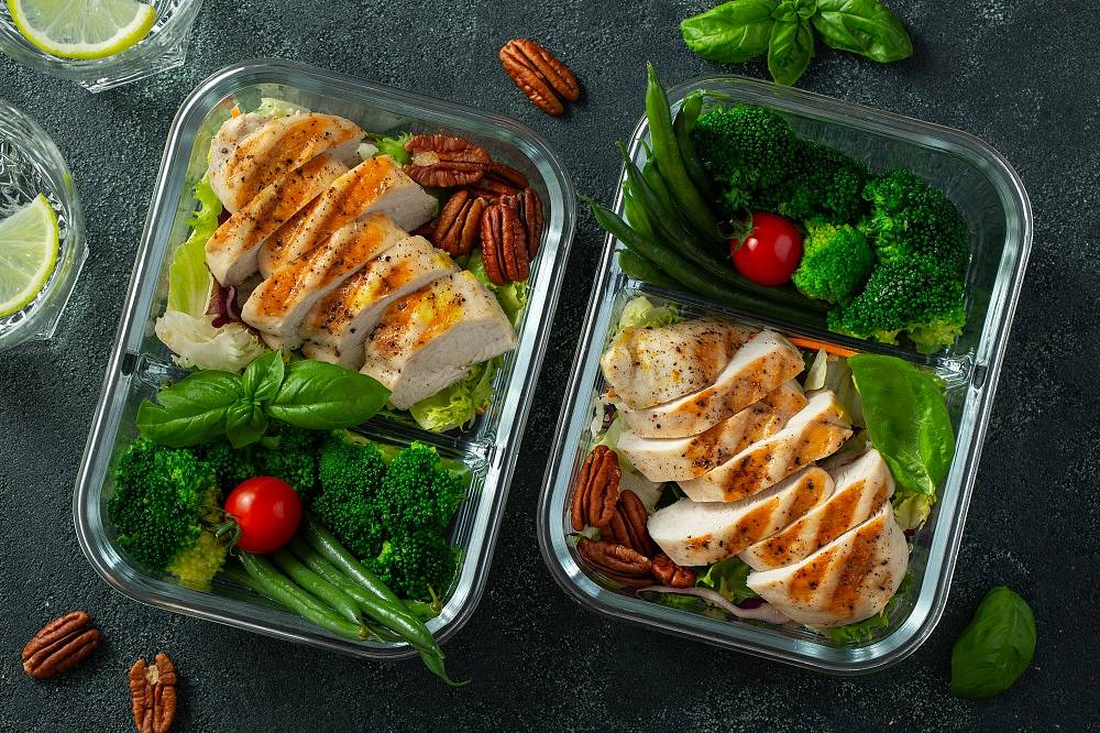 Healthy meal prep containers with chicken breast