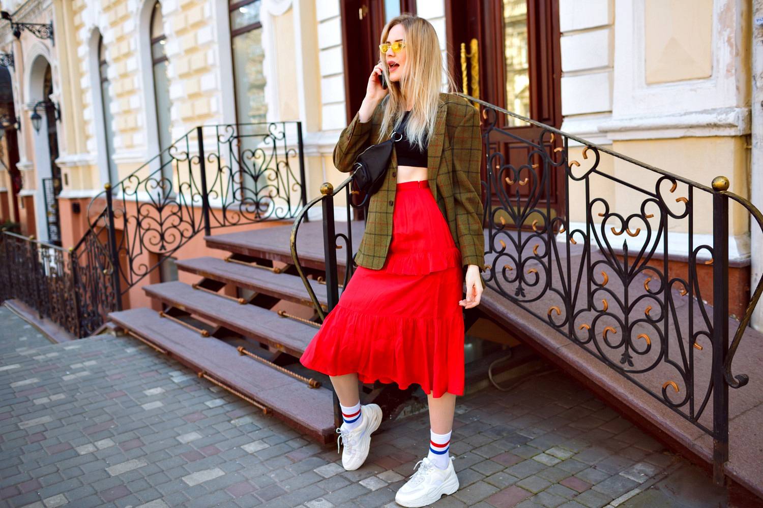 Elegant trendy blonde woman posing on the street
