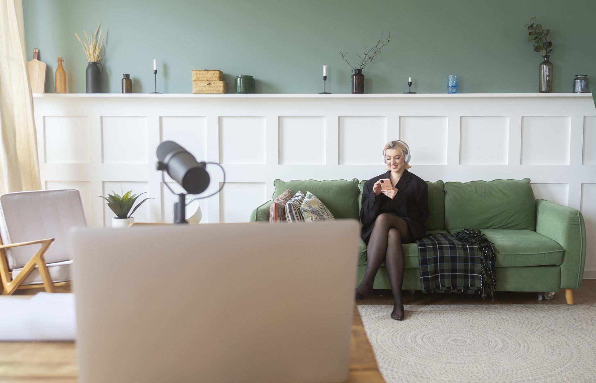 full shot woman sitting couch