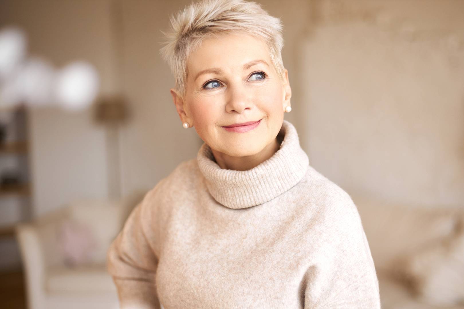 beautiful happy retired woman wearing cozy sweater short hairdo wp